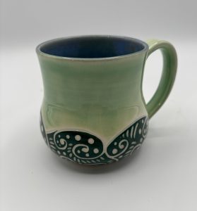 green sgraffito mug