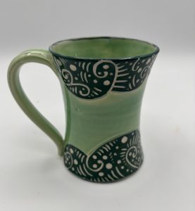 green sgraffito mug